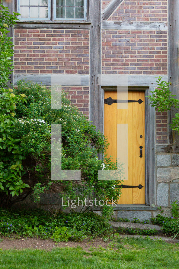 door on brick house in garden