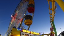 Ride tickets and Ferris Wheel at amusement park