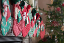 Christmas stockings hung over a fireplace 