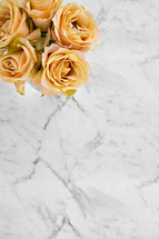 yellow roses on marble 