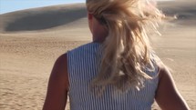 woman walking in a desert 