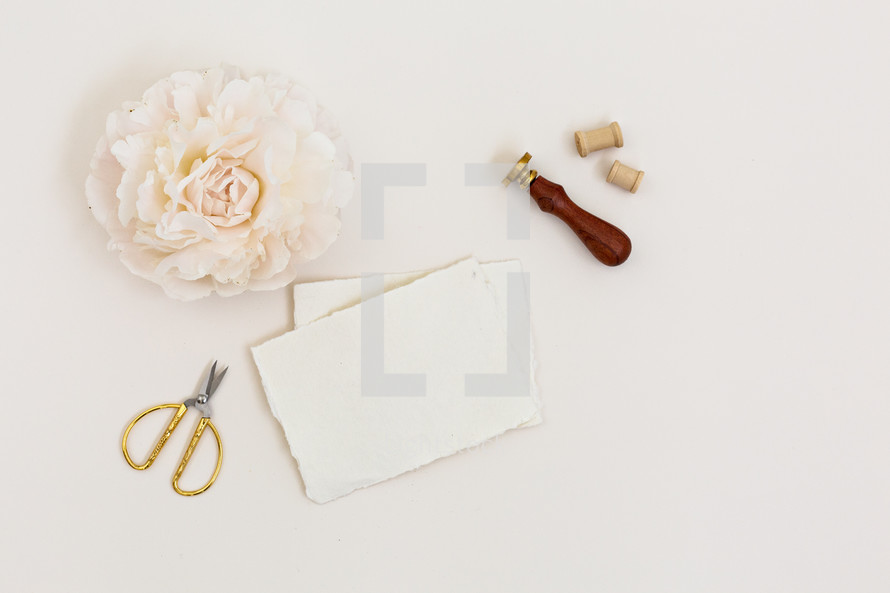 soft pink flowers and stationary 