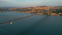Istanbul Turkey Drone Aerial view above martyrs bridge across bosphorus strait towards ortaköy capturing traffics crossing and beşiktaş cityscape 
