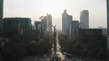 Angel of Independence And Traffic At Paseo de la Reforma In Downtown Mexico City, Mexico. - aerial	