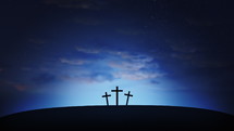 Three crosses on the hill with clouds moving on blue starry sky. Easter, resurrection, new life, redemption concept. Seamless looping background 