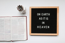 on earth as it is in heaven sign and open Bible 