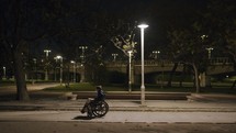 Evening outing of a handicapped child in empty park