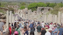 Tourists visiting main street in ancient city Ephesus, Anatolia in Selcuk, Turkey. 
