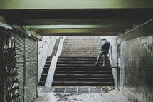 man on the stairs of a subway station