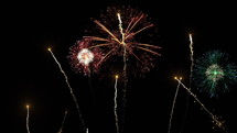 Brightly colorful fireworks for New Year and other events celebration on dark background. 