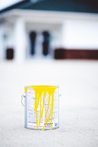 yellow paint in a paint can 
