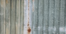 Abstract textures and patterns - metal wall panels with rust and corrosion stains