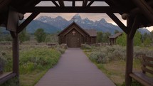 Old Wooden Chapel in the Mountains at Sunset