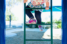 girl climbing on a playground 