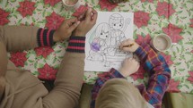child coloring a child Christmas page 