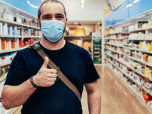 man wearing a face mask at a store 
