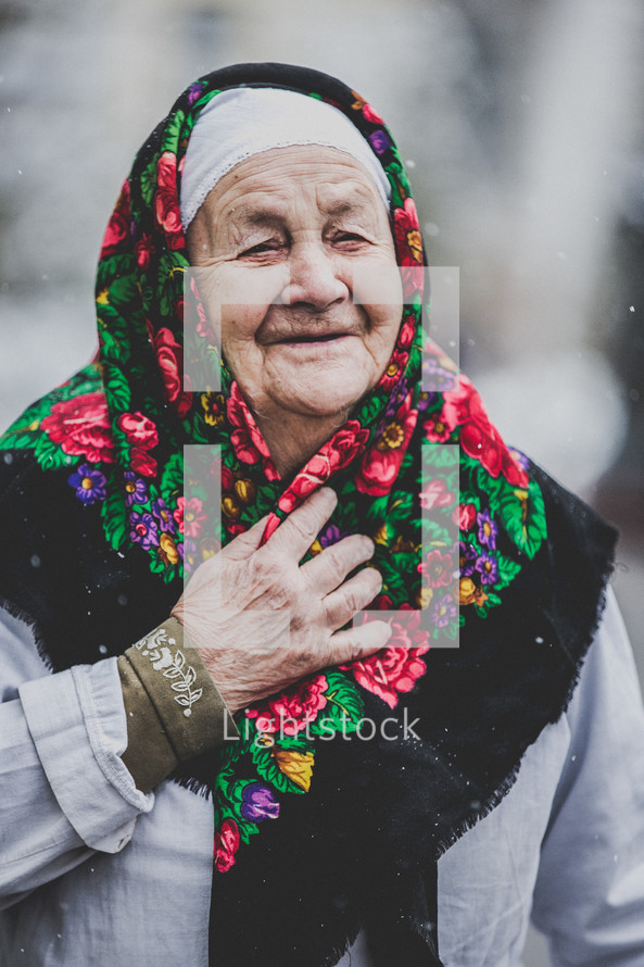 elderly woman wearing a scarf