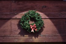 Christmas wreath against a brown background 