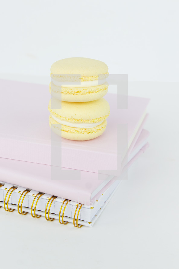 macaroons on pink notebooks 