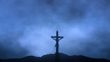 Jesus silhouette crucified on Calvary at night
