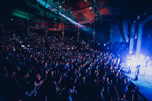 audience worshiping and praising at a concert 