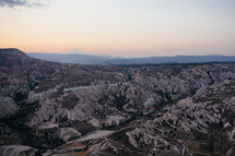 hot air balloons over Cappadocia landscape 