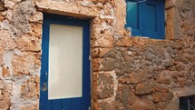 Window of a typical Siclian house with blue color in Marzamemi