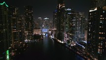 Tracking Drone Shot of Miami River and Downtown City Skyline at Night