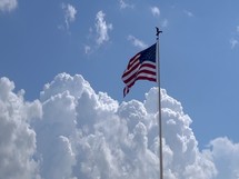 The American flag proudly blowing in the wind.