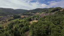 Overhead view of a German town surrounded by a lush green landscape