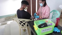 Asian Nurse Checking Patients Blood Pressure