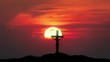 "Cross of Jesus from Calvary hill.
Big sun and moon with silhouette of Holy Cross and storm. 
Passing Time concept"
