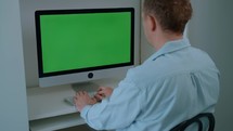 Man working on a desktop computer