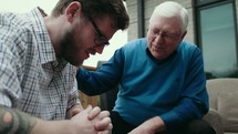 a senior man mentoring a young man 