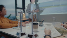 Wind Turbine Models on Table during Meeting of Sustainable Energy Engineers