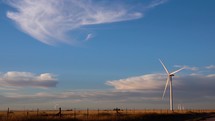 Wind turbine in wide open sky in Eastern New Mexico