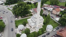 Ferhat Pasha Mosque aerial view rotating above stunning Ottoman Islamic tower in Banja Luka, Bosnia