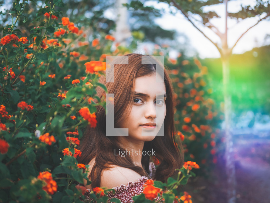 portrait of a teen girl in red flowers 
