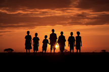 A photo of silhouettes of children in Africa at sunset