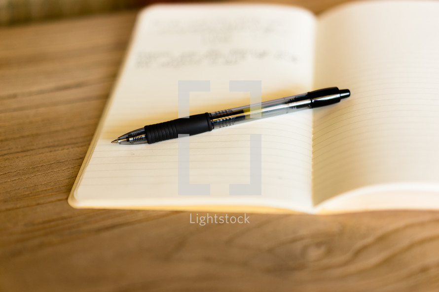 a pen on a journal 