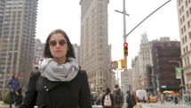 Fashion woman in front of Flatiron Building in New York City
