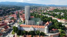 Aerial shot drone orbits to the right around Cathedral of Zagreb in Croatia
