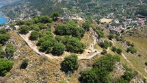 Aerial shot drone flies toward castle atop La Rocca in Cefalu, Sicily, Italy