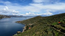 Aerial shot drone flies low along path on Isla del Sol in Lake Titicaca