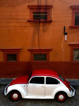 red and white Volkswagen Beetle 