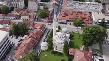 Aerial orbiting shot of Ferhadija Mosque, Famous mosque in Banja Luka City, Bosnia and Herzegovina