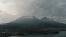 Scenic View Of Lake Atitlan In Guatemala in A Misty Afternoon - aerial shot	