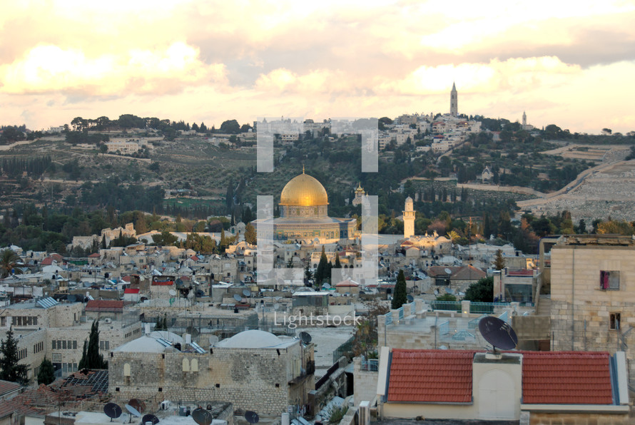he Dome of the Rock and the Mount of Olives near sunset.