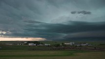 Farm And A Big Storm Moving Across The Open Plains Timelapse
