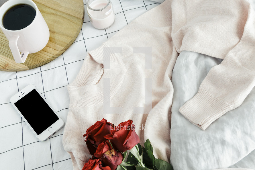 sweater, roses, sheets, linens, bed, bedding, bedspread, iphone, planner, journal, pencil, reading glasses, candle, coffee mug, grid